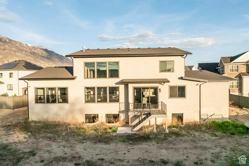 Rear view of property featuring a mountain view
