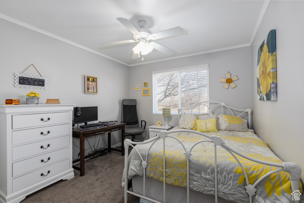Bedroom with carpet flooring, crown molding, and ceiling fan