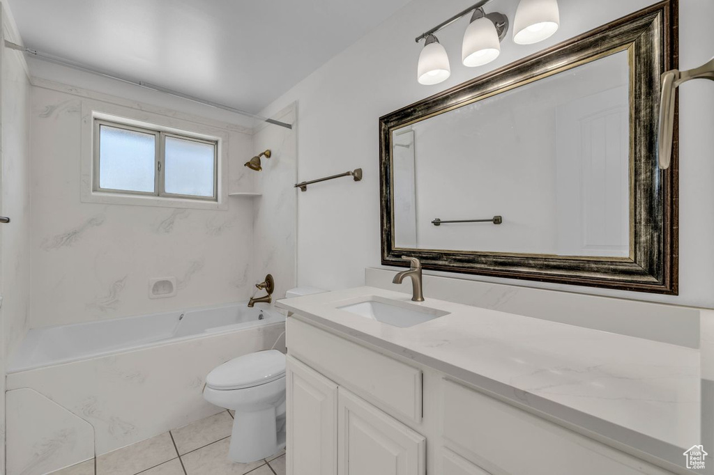 Full bathroom with oversized vanity, shower / tub combination, tile floors, and toilet