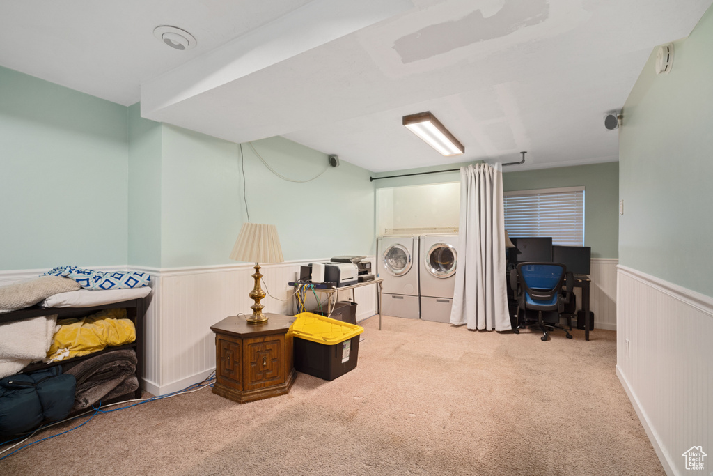 Sitting room featuring carpet flooring and separate washer and dryer