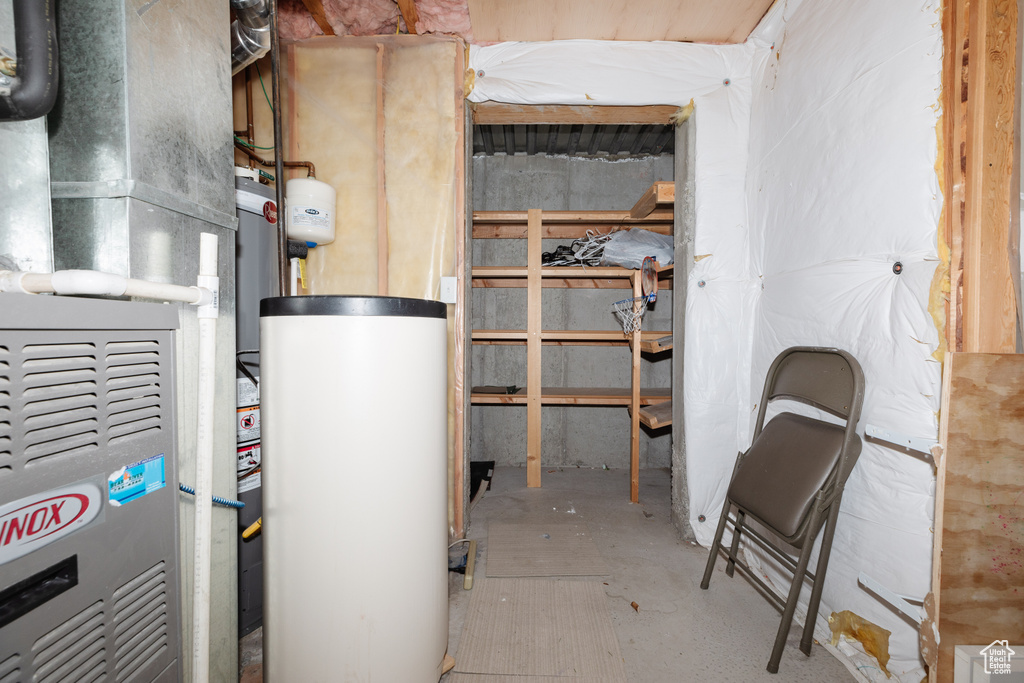Utility room featuring heating utilities and gas water heater