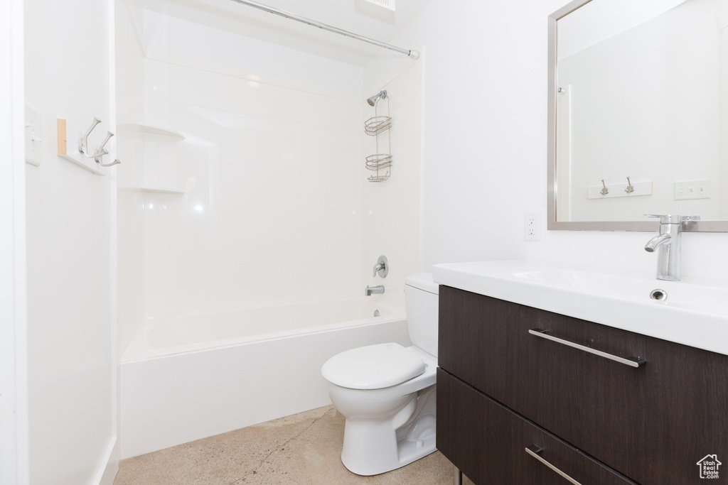 Full bathroom with shower / washtub combination, tile floors, vanity, and toilet