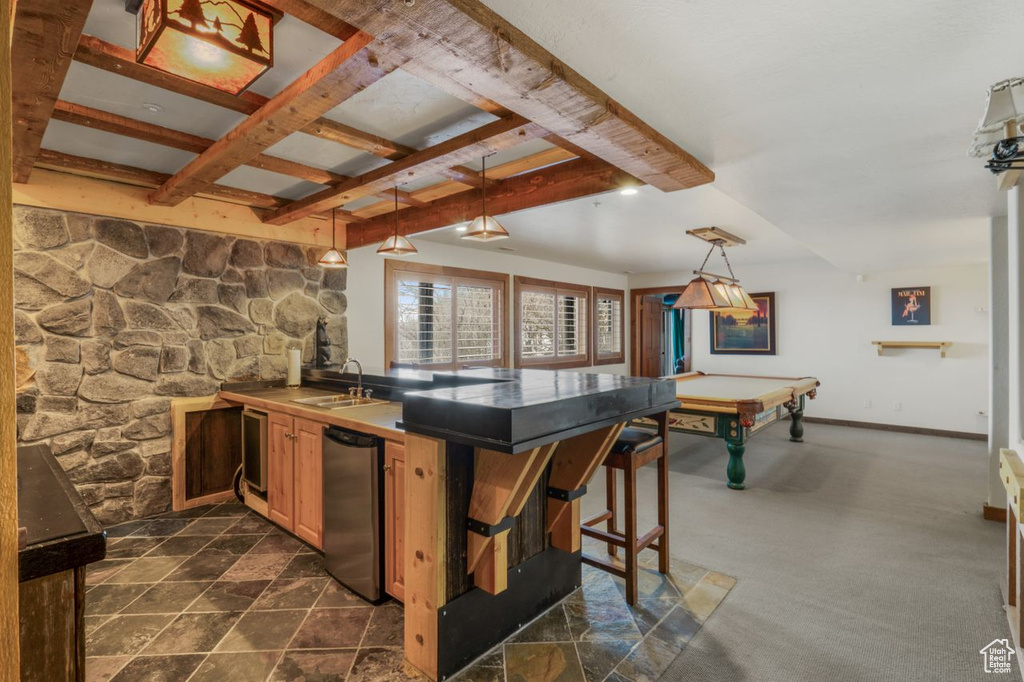 Kitchen with beamed ceiling, a breakfast bar, sink, pool table, and stainless steel dishwasher