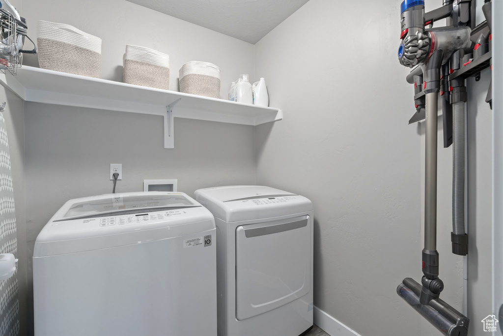 Laundry room featuring washer hookup and washer and dryer