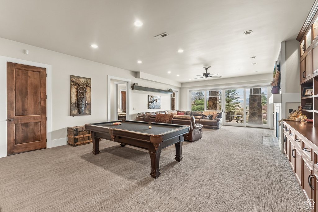 Playroom featuring light colored carpet, ceiling fan, and billiards