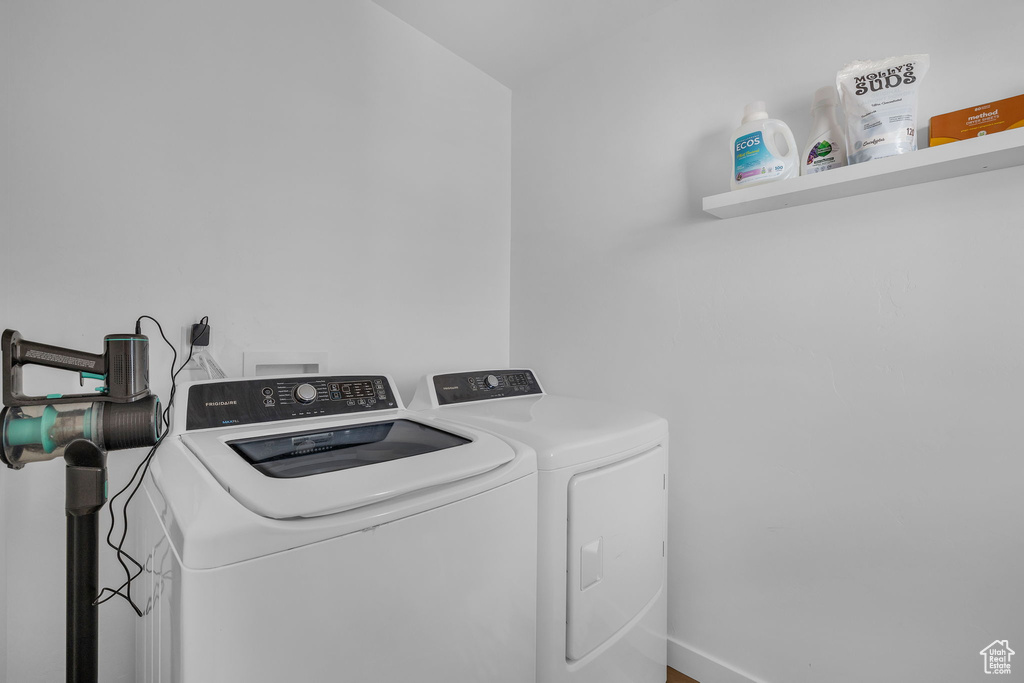 Washroom featuring washing machine and dryer