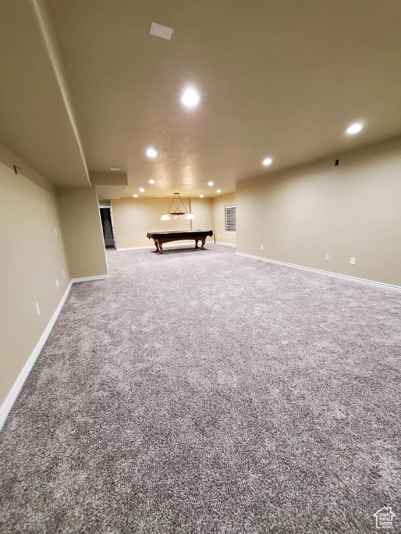 Basement featuring carpet and billiards