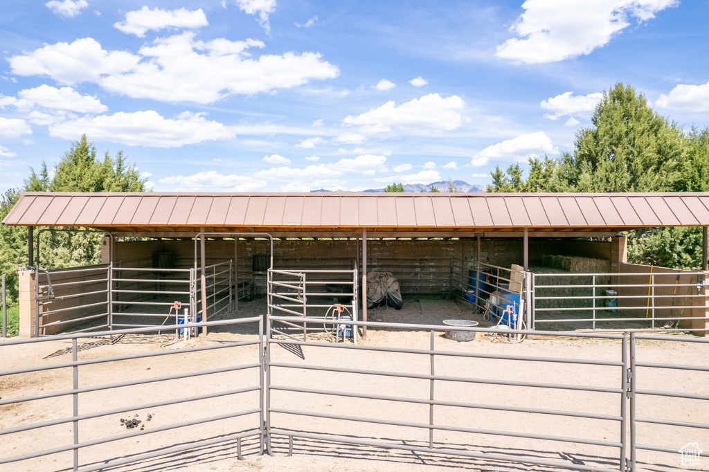 View of horse barn with an outdoor structure