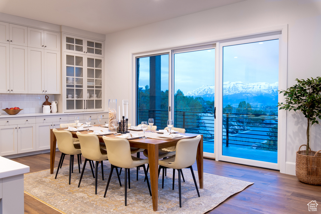Dining room featuring hardwood / wood-style floors and a mountain view