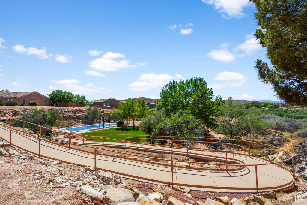 View of home\'s community with a swimming pool