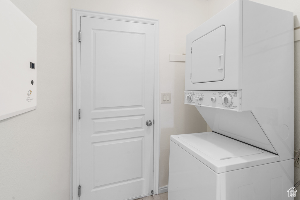 Laundry area featuring stacked washer / dryer