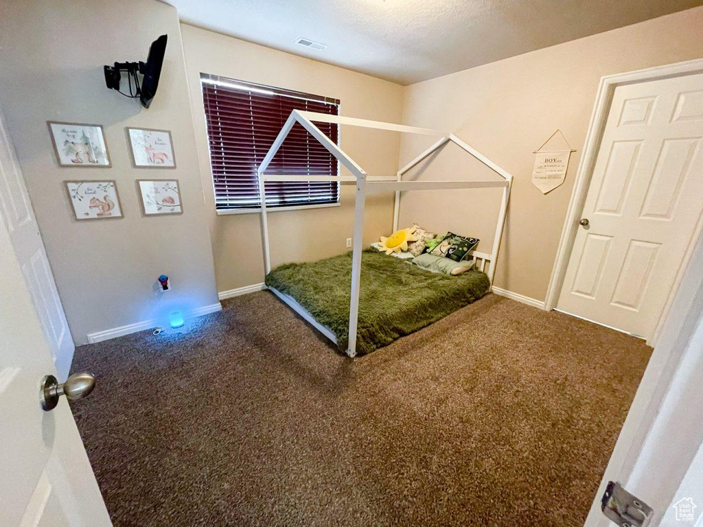 Unfurnished bedroom with carpet floors