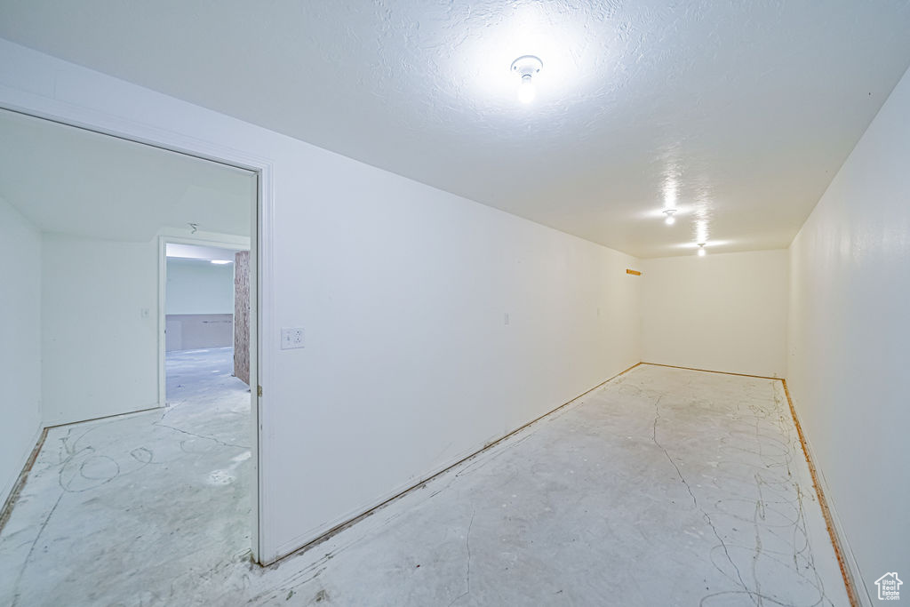 Basement with a textured ceiling