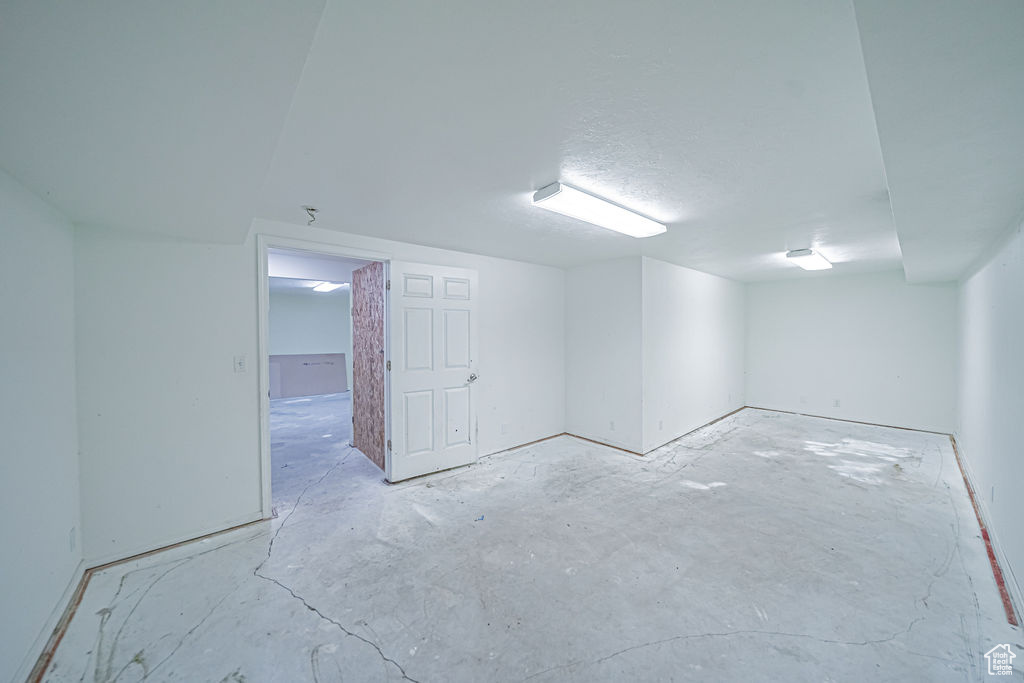 Basement with a textured ceiling