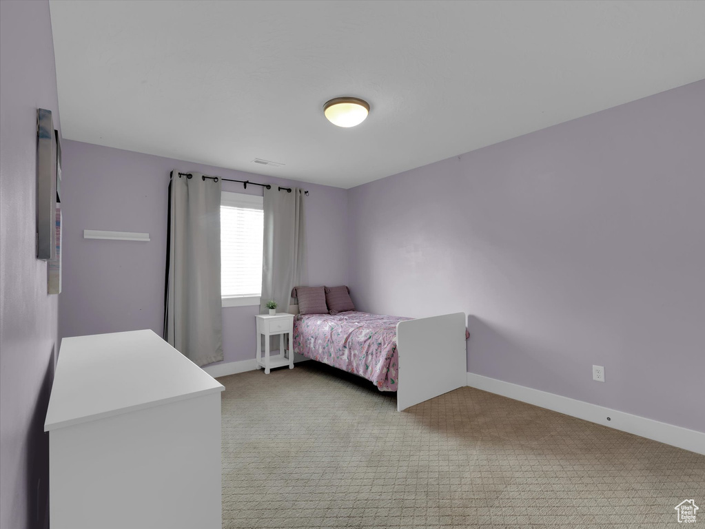 Bedroom featuring carpet floors