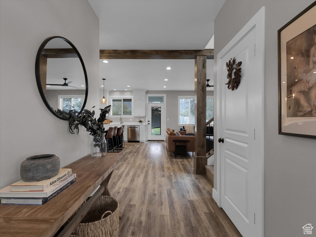 Entrance foyer with hardwood / wood-style flooring and ceiling fan