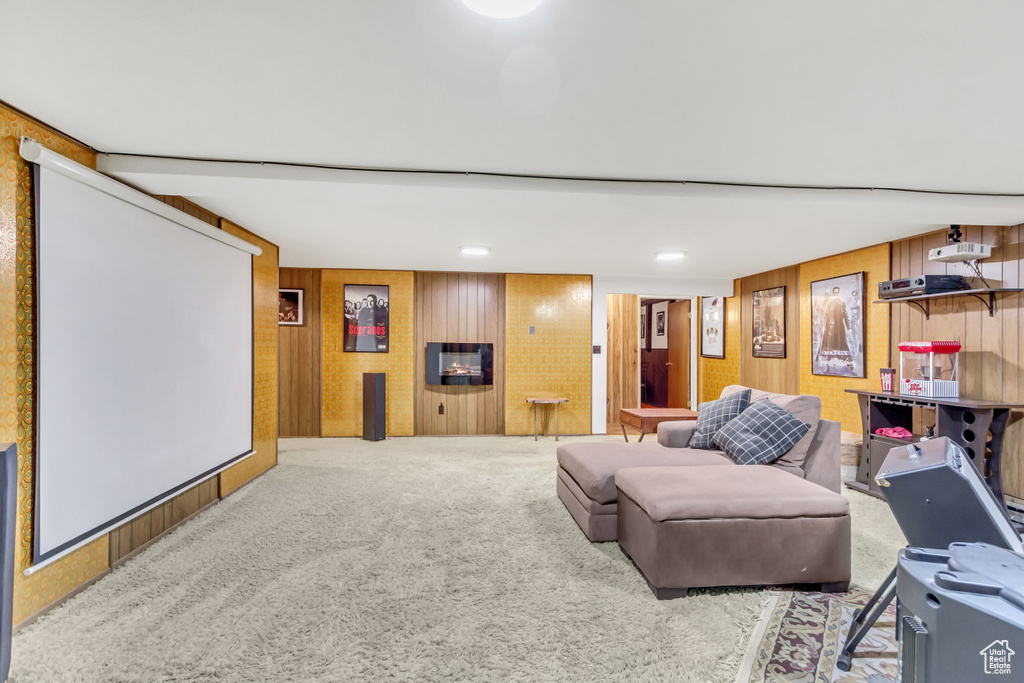 Interior space featuring wooden walls and carpet flooring