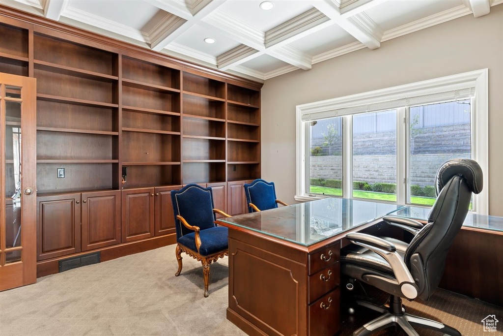 Office area with coffered ceiling, light colored carpet, and beam ceiling