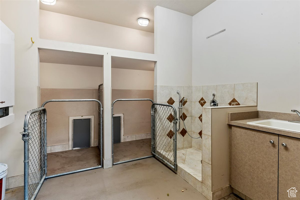 Bathroom featuring vanity and concrete floors