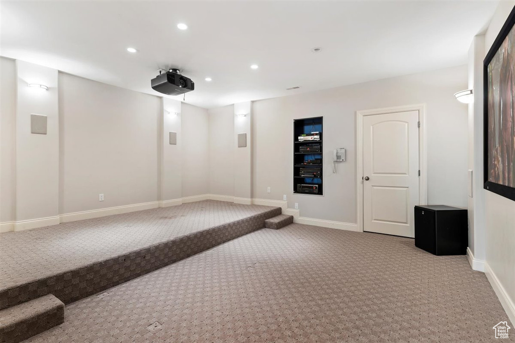 Cinema room featuring carpet floors