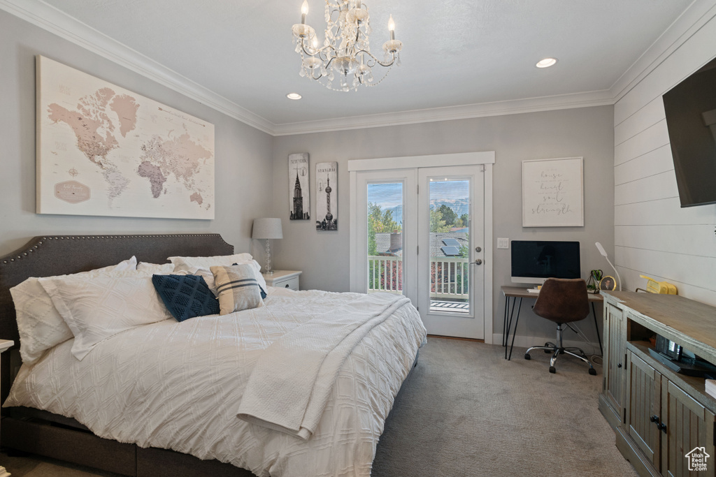 Bedroom featuring ornamental molding, a notable chandelier, carpet, and access to outside