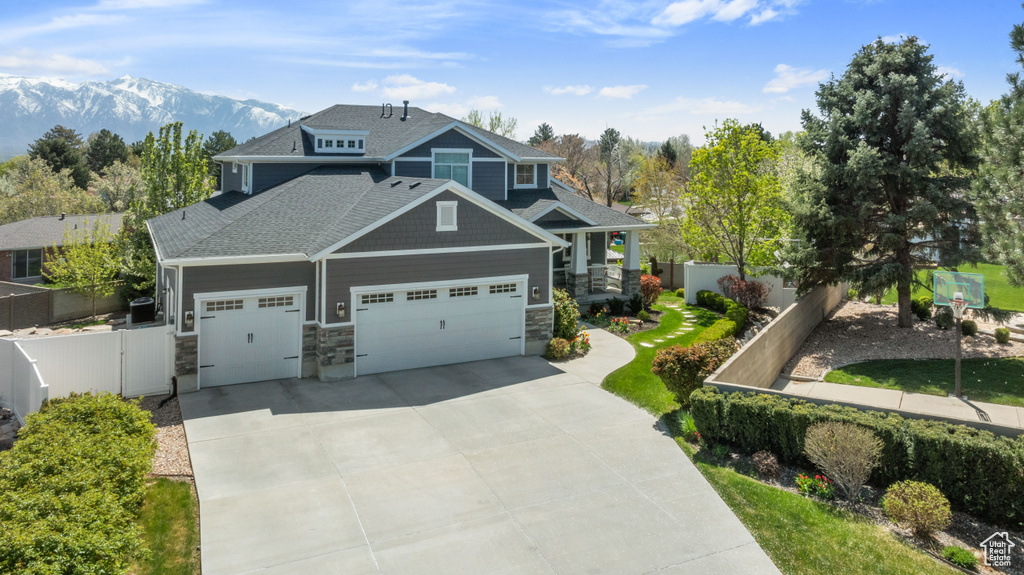 Craftsman-style home with a mountain view and a garage