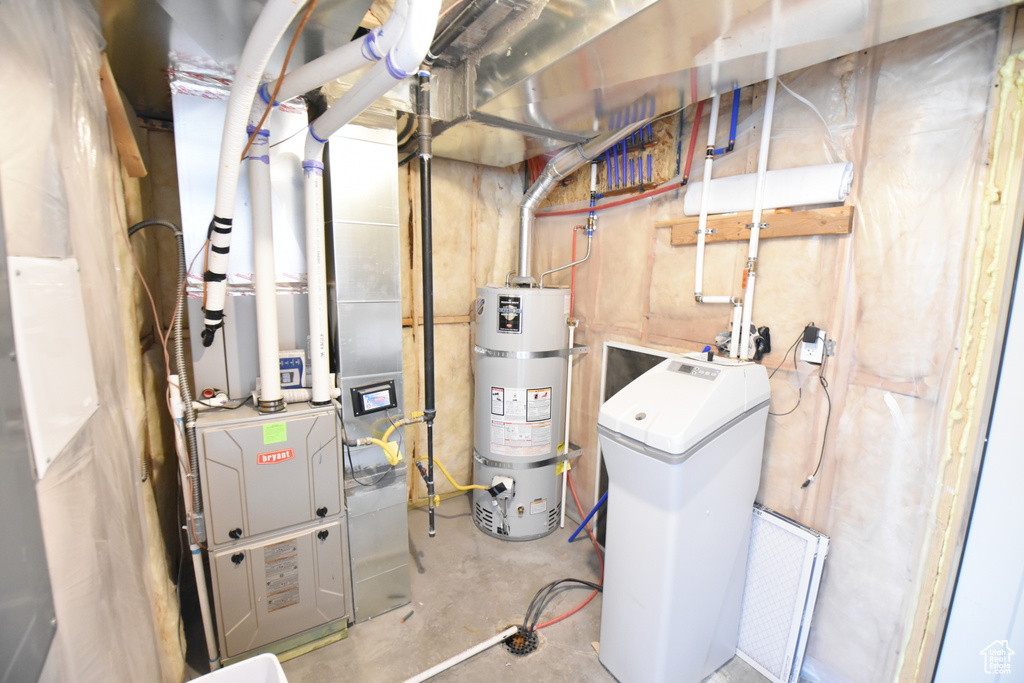 Utility room featuring secured water heater