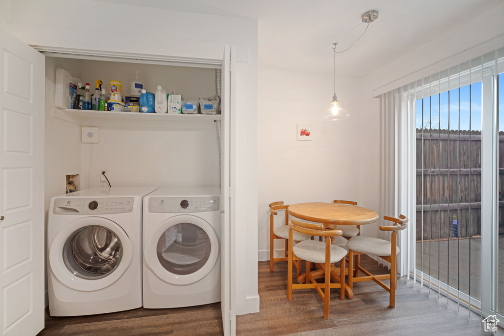 Laundry room featuring independent washer and dryer, hardwood / wood-style flooring, and washer hookup