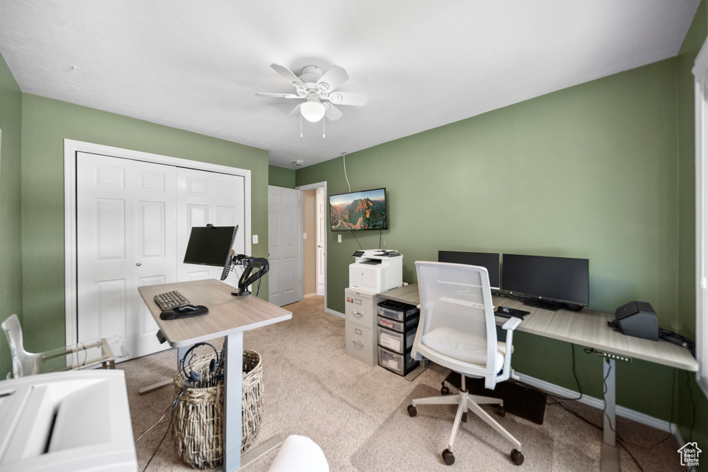 Office area featuring ceiling fan and carpet flooring