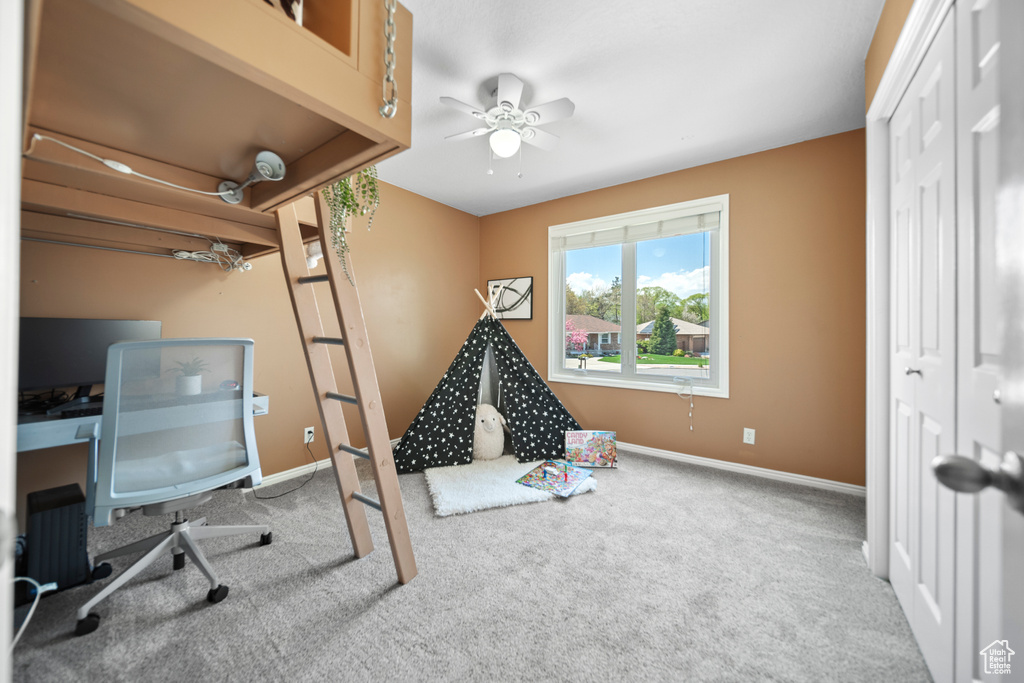 Office with ceiling fan and carpet floors