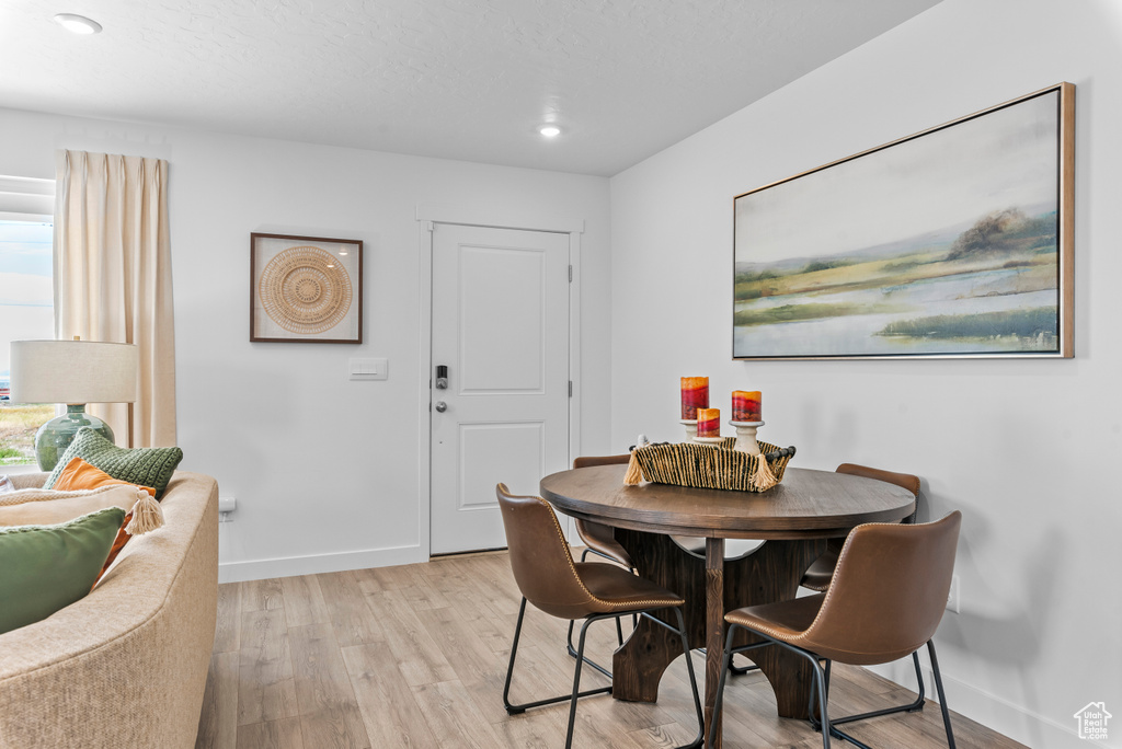 Dining room with light hardwood / wood-style floors