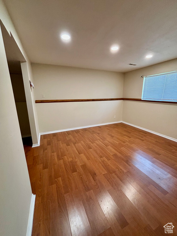 Empty room featuring hardwood / wood-style floors