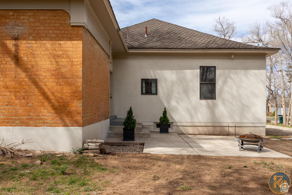 Rear view of property with a patio
