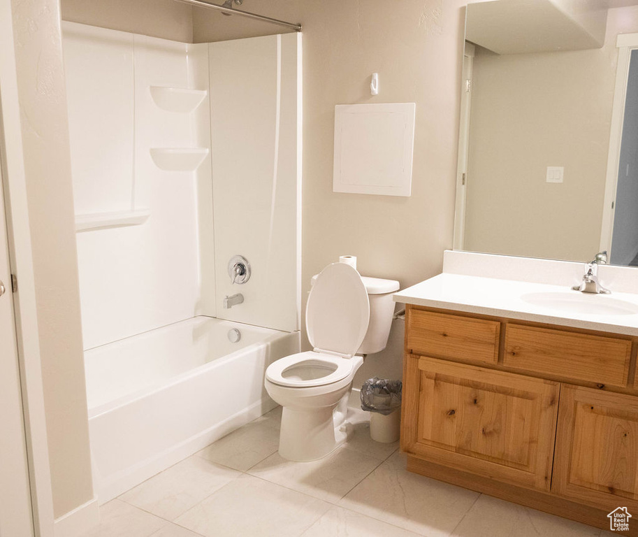 Full bathroom featuring tile floors, shower / bathing tub combination, vanity, and toilet
