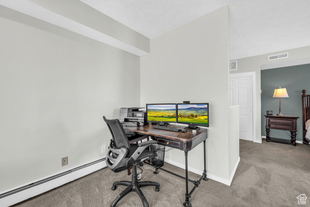 Office featuring a baseboard radiator and carpet floors