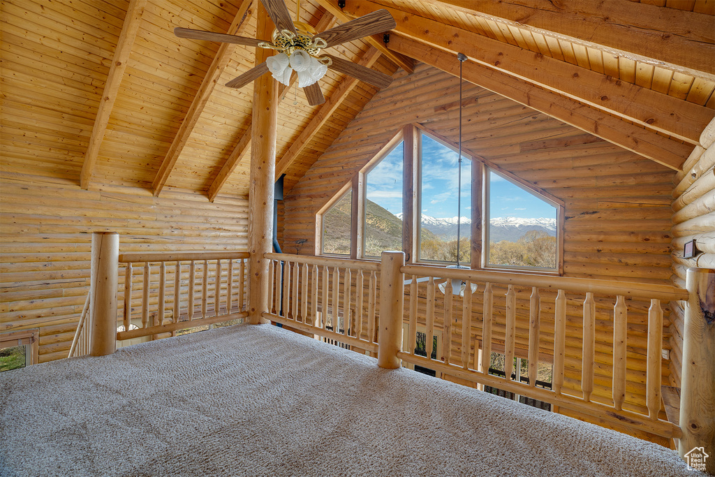 Bonus room featuring high vaulted ceiling, log walls, beamed ceiling, and wooden ceiling