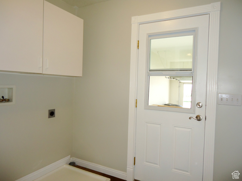 Laundry area featuring cabinets, hookup for an electric dryer, and washer hookup