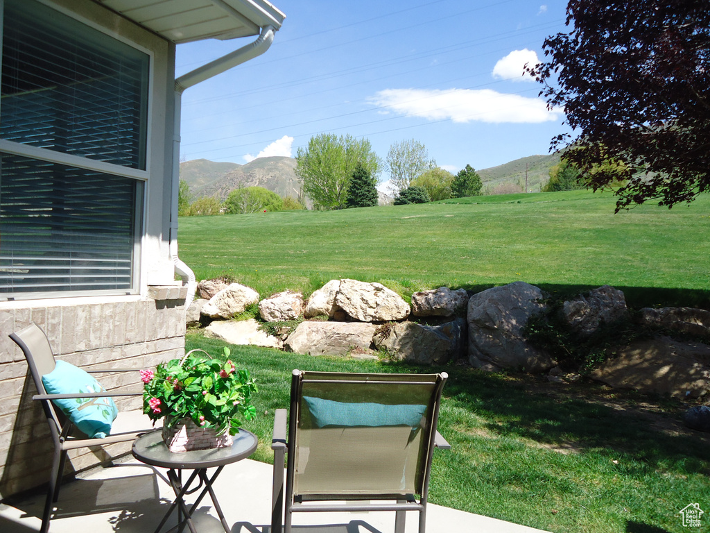 View of yard with a mountain view and a patio