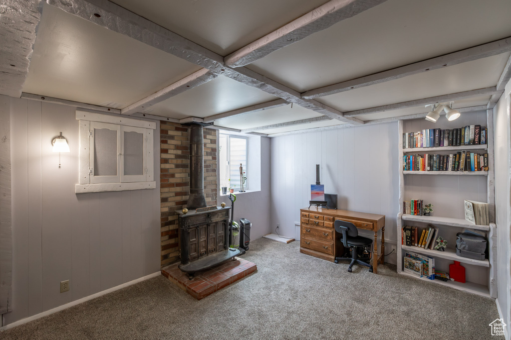 Interior space featuring brick wall and a wood stove