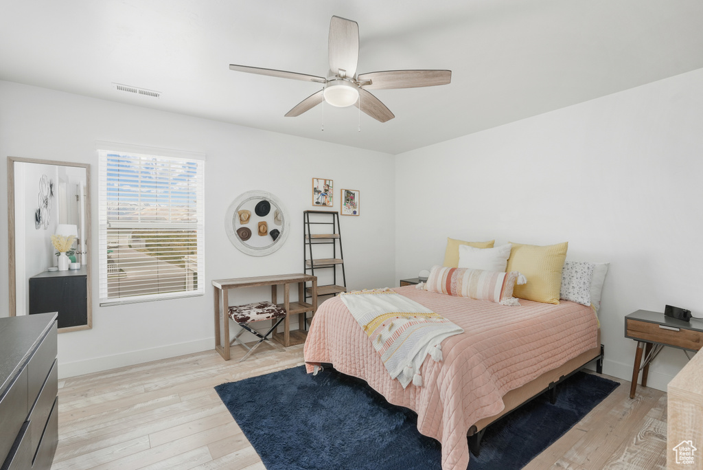 Bedroom featuring light hardwood / wood-style flooring and ceiling fan