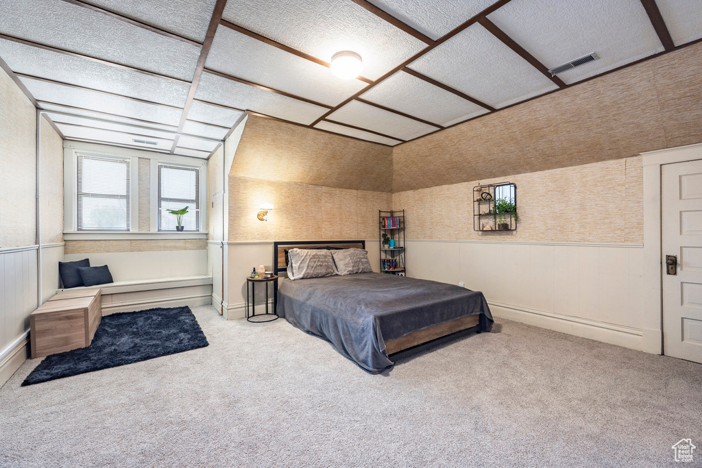 Carpeted bedroom featuring a baseboard radiator