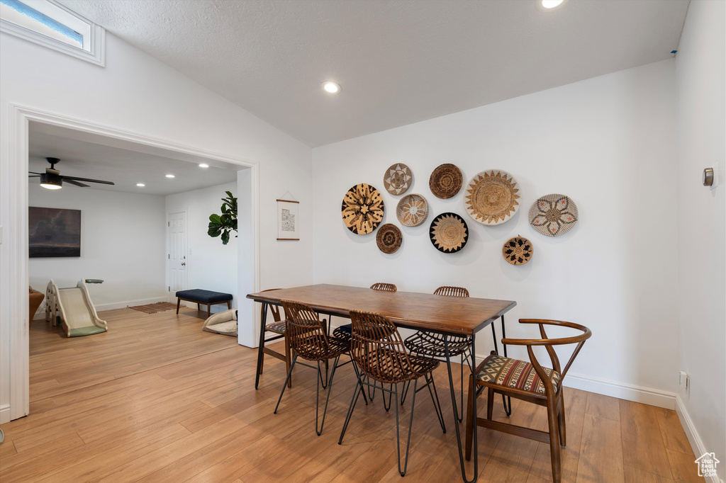 Dining area featuring ceiling fan and light hardwood / wood-style floors