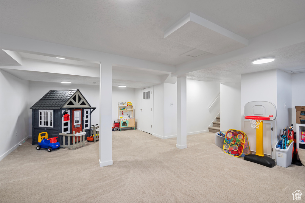 Playroom featuring carpet