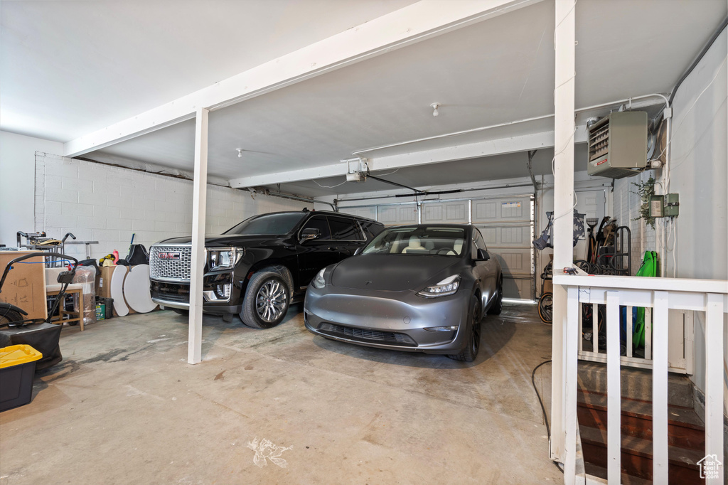Garage with a carport and a garage door opener
