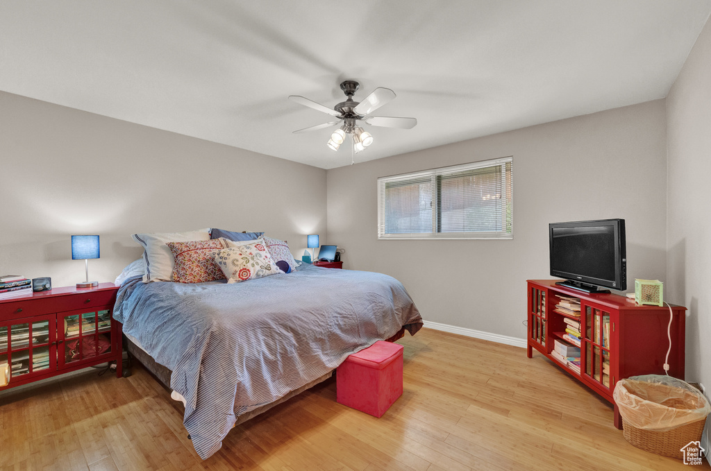 Bedroom featuring wood-type flooring and ceiling fan
