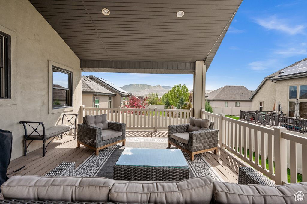 Deck featuring a mountain view and outdoor lounge area