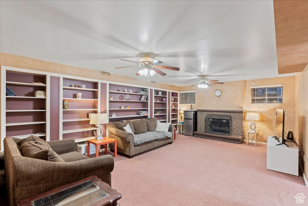 Living room featuring carpet flooring and ceiling fan