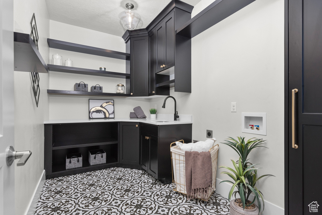 Interior space with sink and light tile flooring
