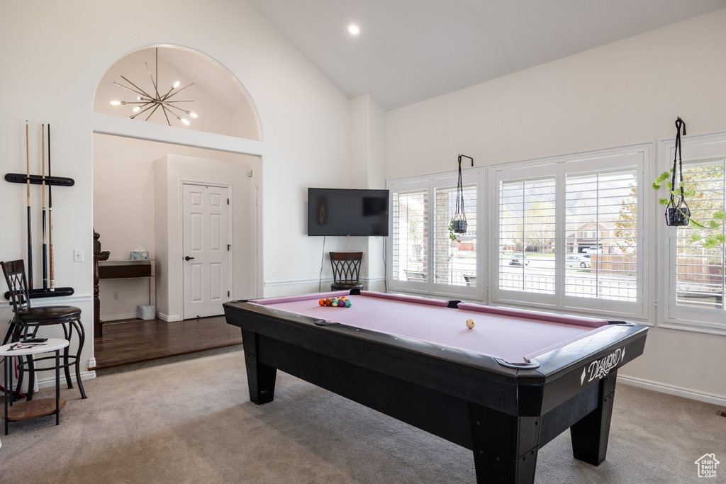Rec room with pool table, high vaulted ceiling, and carpet floors