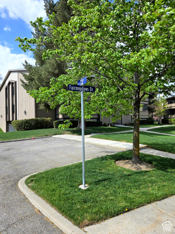 Community / neighborhood sign with a yard